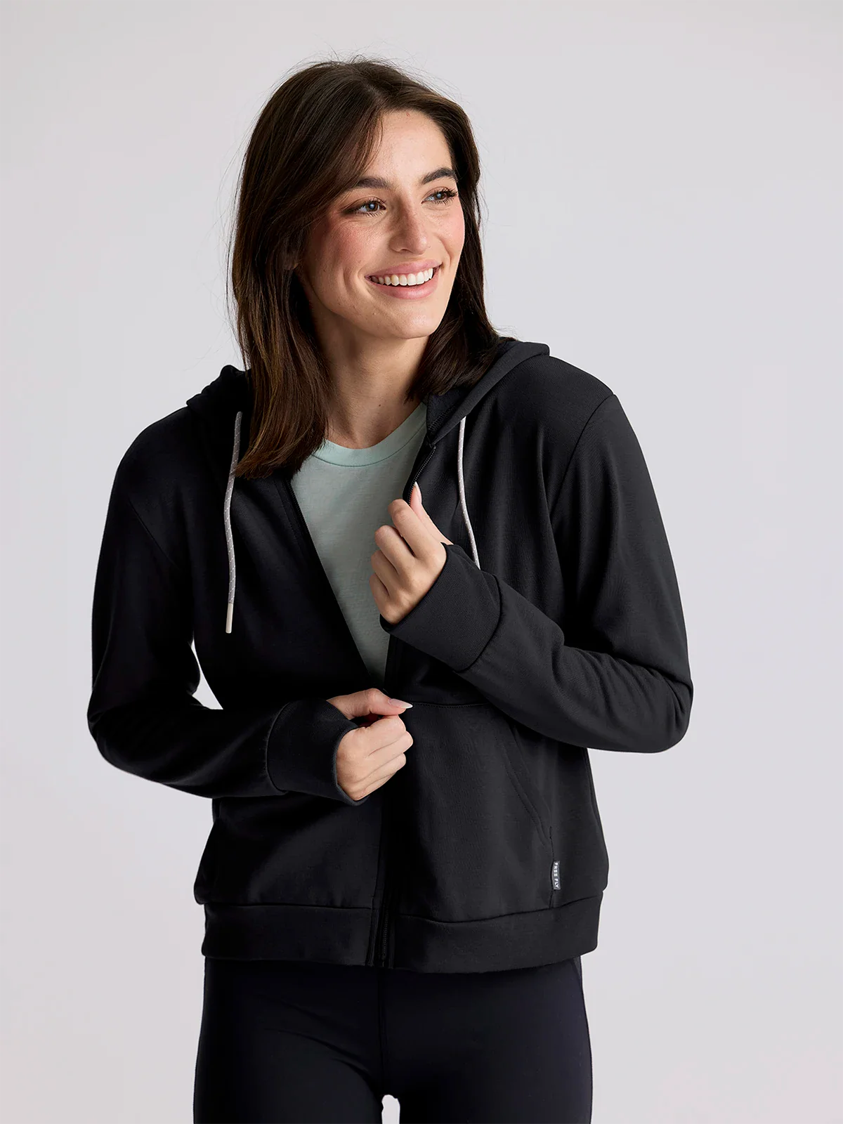 Free Fly Women's Bamboo Lightweight Fleece Zip Hoodie in Heather Black Hoodie with Hem Embroidery Detailed Premium